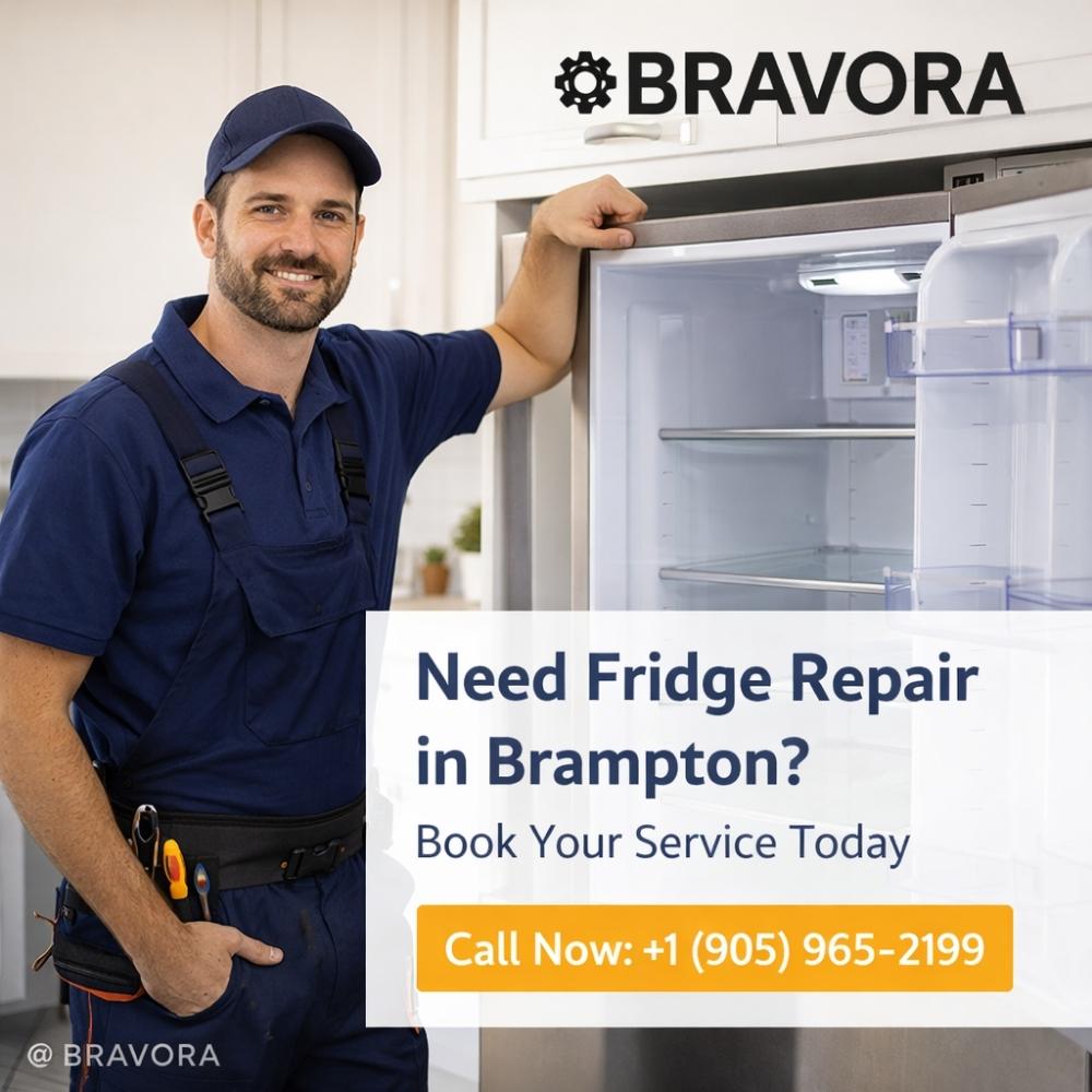 Friendly appliance technician standing beside open fridge promoting refrigerator repair service in Brampton ON